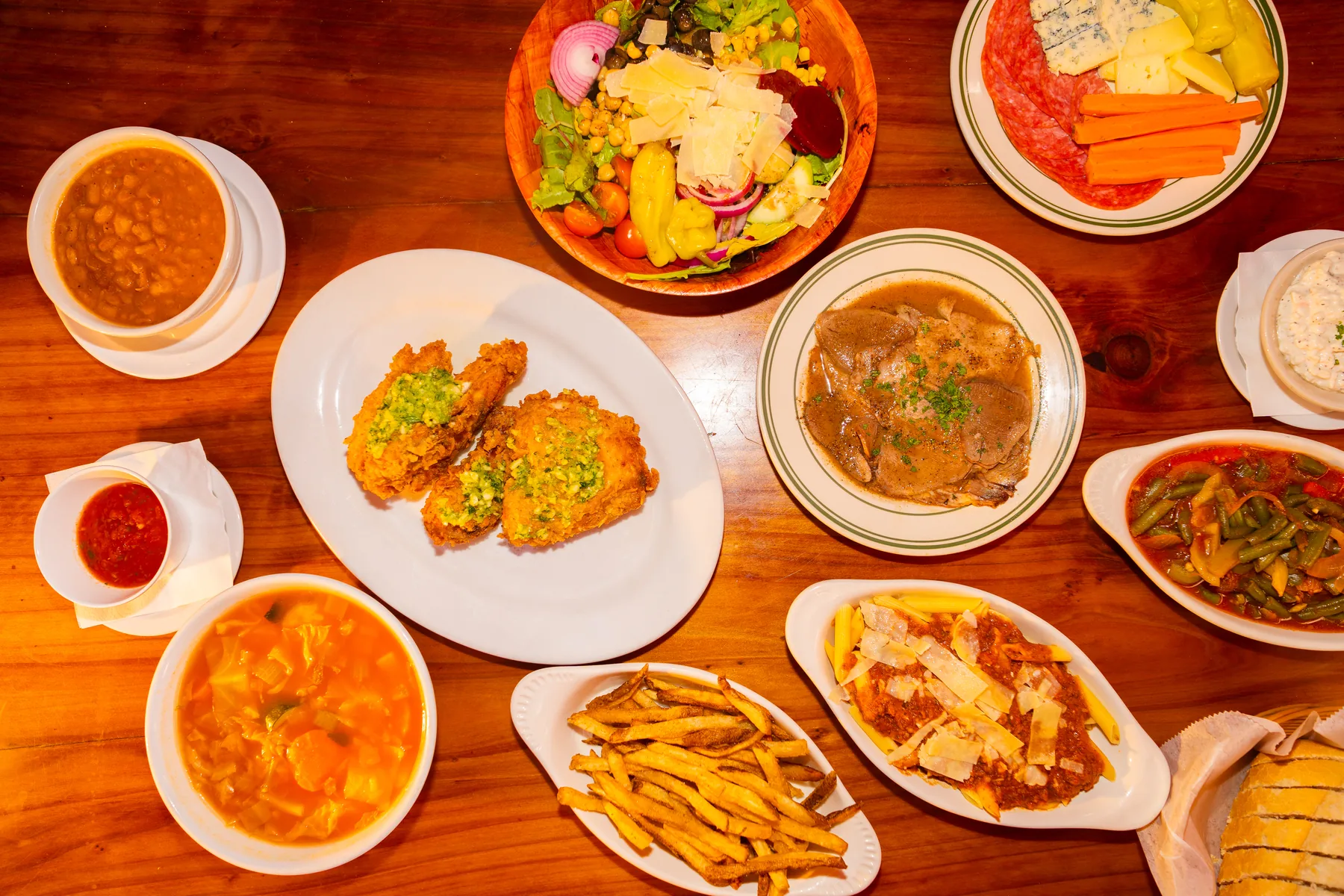A table filled with the complete Basque-style setup at Pyrenees Cafe